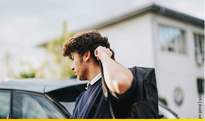 A man leaving a vehicle